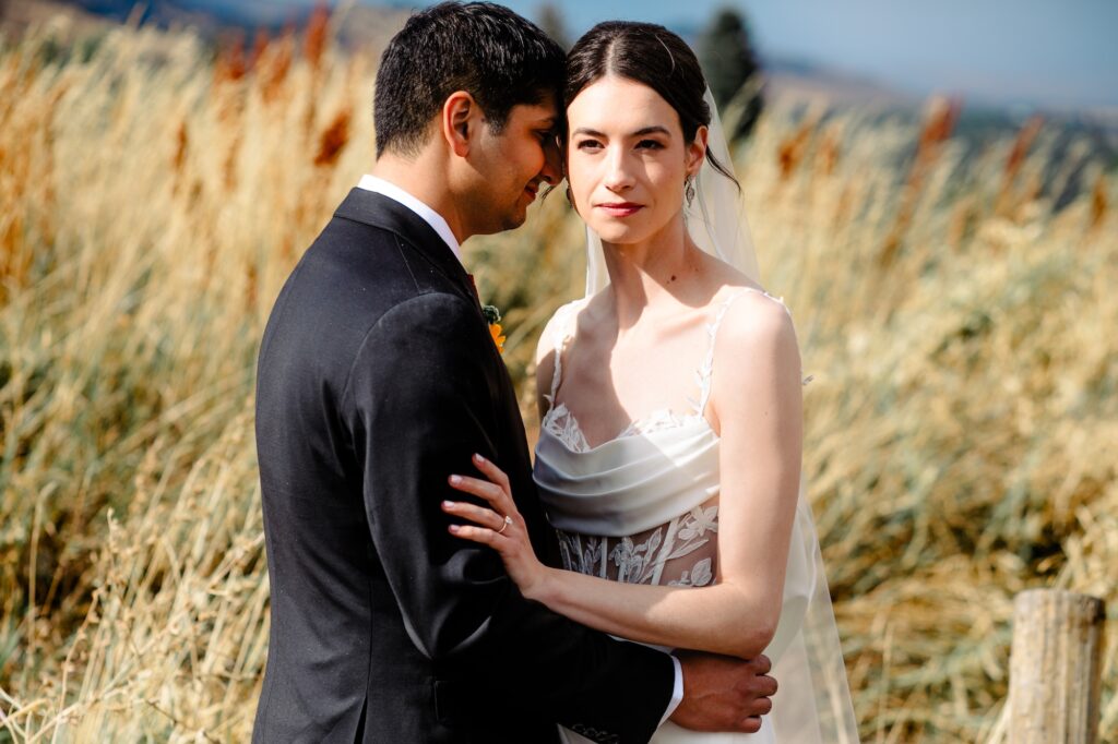 groom looks at bride during wedding portrait
