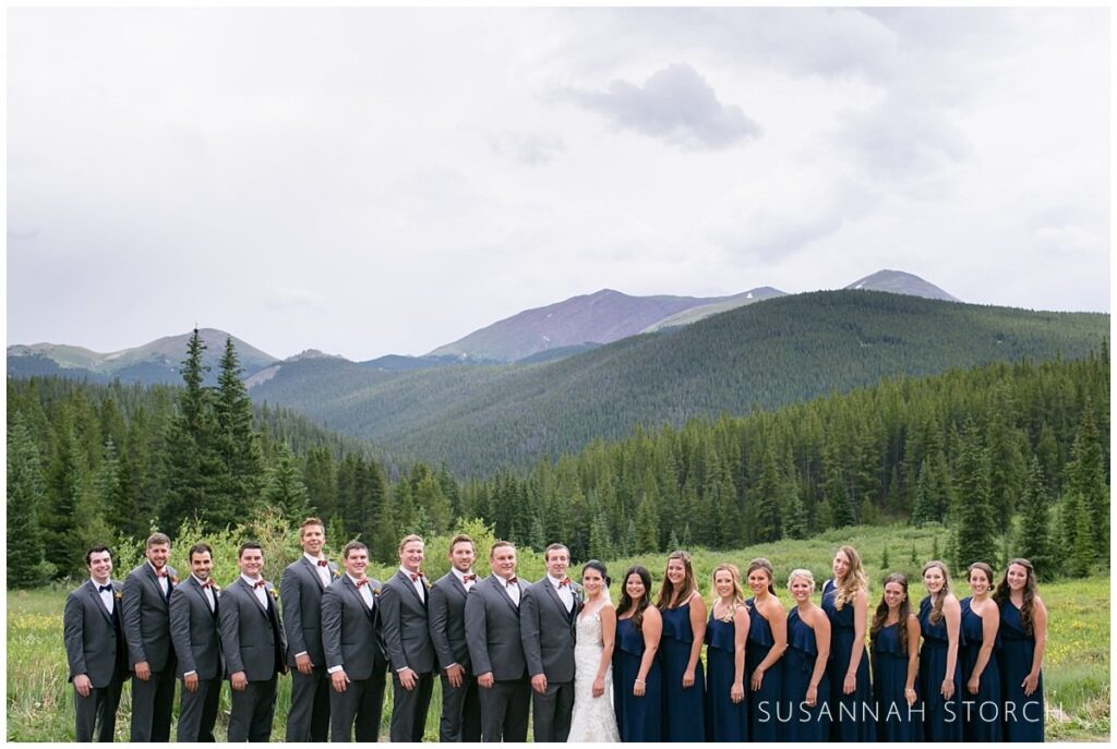 bridal party portrait taken in front of green mountain in breckenridge, colorado